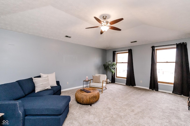 sitting room with lofted ceiling, a textured ceiling, ceiling fan, and carpet flooring