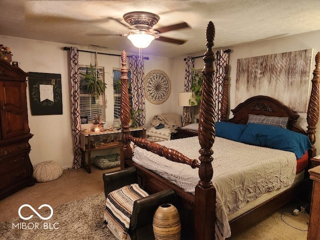 carpeted bedroom with a textured ceiling and ceiling fan