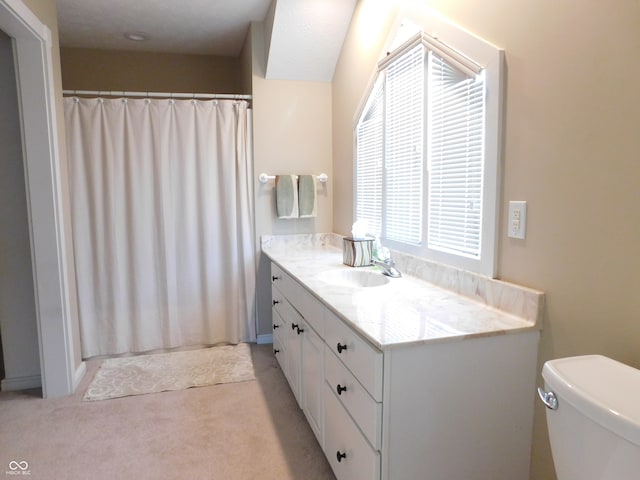 bathroom with vanity, toilet, and a shower with shower curtain