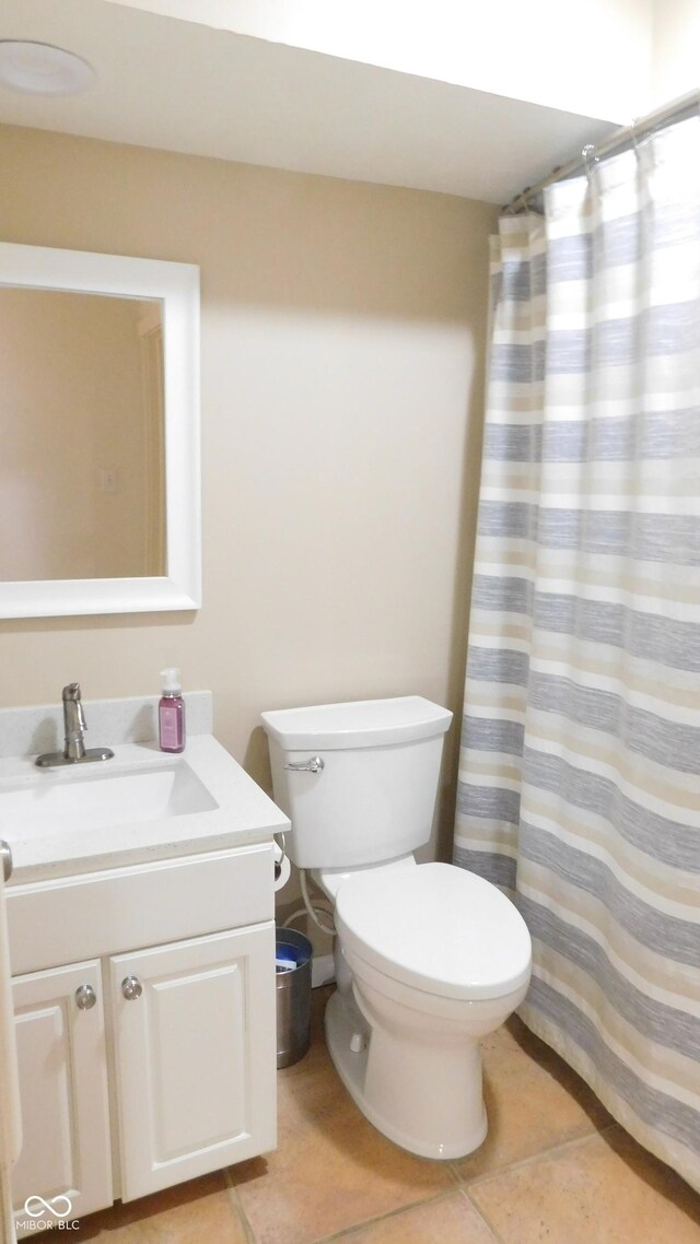 10781 Cedar Ridge Ln, Brownsburg, IN 46278 - bathroom featuring tile patterned floors, curtained shower, vanity, and toilet
