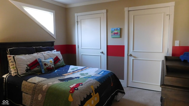 bedroom with carpet flooring and crown molding