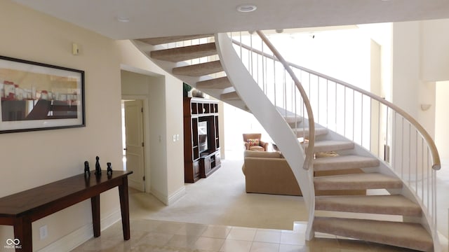 stairs featuring carpet floors