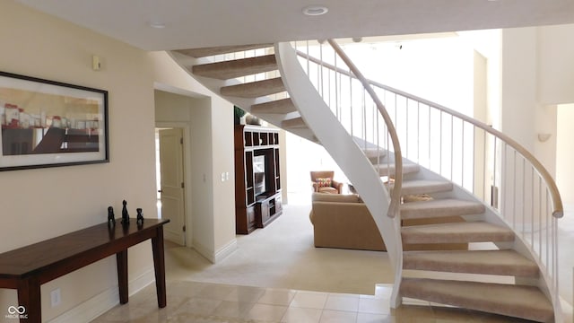10781 Cedar Ridge Ln, Brownsburg, IN 46278 - stairs featuring baseboards, carpet flooring, tile patterned flooring, and a healthy amount of sunlight