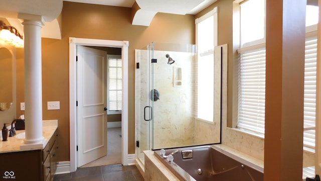 bathroom featuring shower with separate bathtub, tile patterned flooring, vanity, and ornate columns