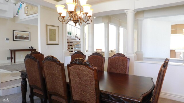 10781 Cedar Ridge Ln, Brownsburg, IN 46278 - dining room with ornate columns and an inviting chandelier