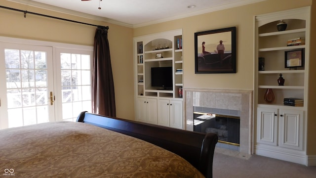 bedroom featuring carpet, ornamental molding, and a tiled fireplace