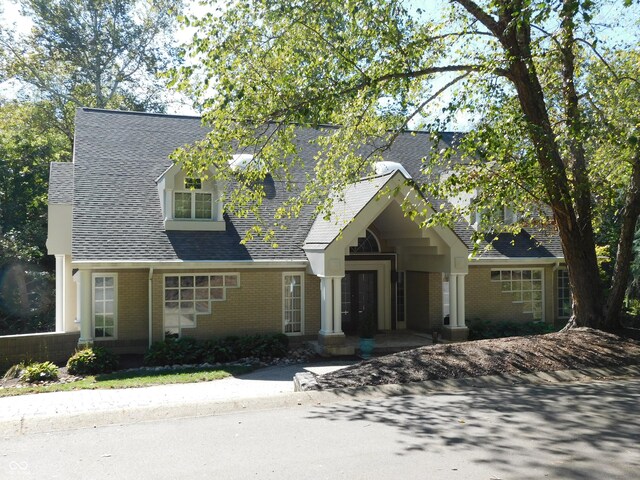 10781 Cedar Ridge Ln, Brownsburg, IN 46278 - view of front of home featuring a shingled roof and brick siding