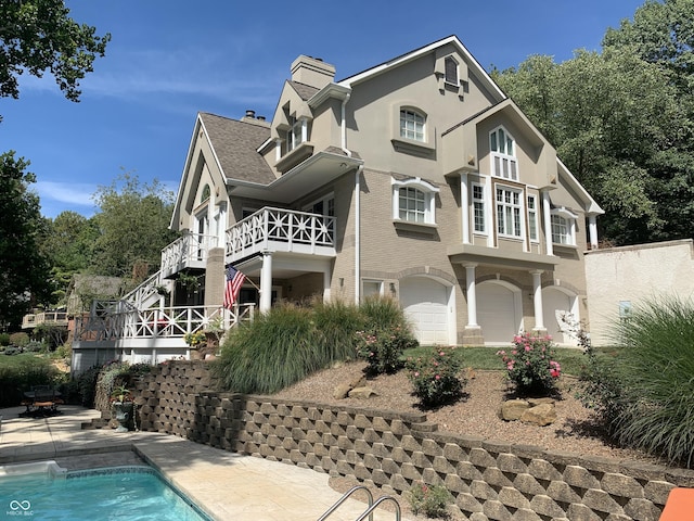 10781 Cedar Ridge Ln, Brownsburg, IN 46278 - view of front facade with an outdoor pool and a chimney