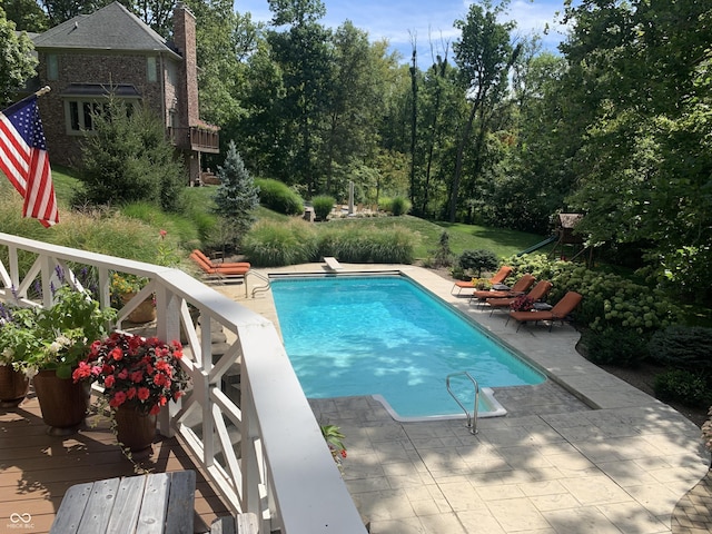 10781 Cedar Ridge Ln, Brownsburg, IN 46278 - outdoor pool with a wooden deck, a patio, and a diving board