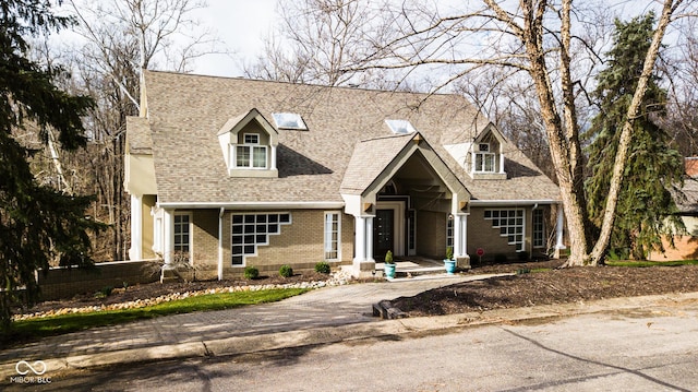 10781 Cedar Ridge Ln, Brownsburg, IN 46278 - new england style home featuring brick siding and a shingled roof