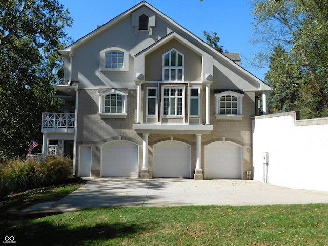 10781 Cedar Ridge Ln, Brownsburg, IN 46278 - view of front of home with brick siding, an attached garage, driveway, and stucco siding