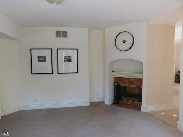 10781 Cedar Ridge Ln, Brownsburg, IN 46278 - unfurnished living room featuring a tile fireplace, carpet flooring, baseboards, and visible vents