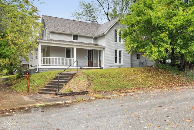 view of front of property featuring covered porch