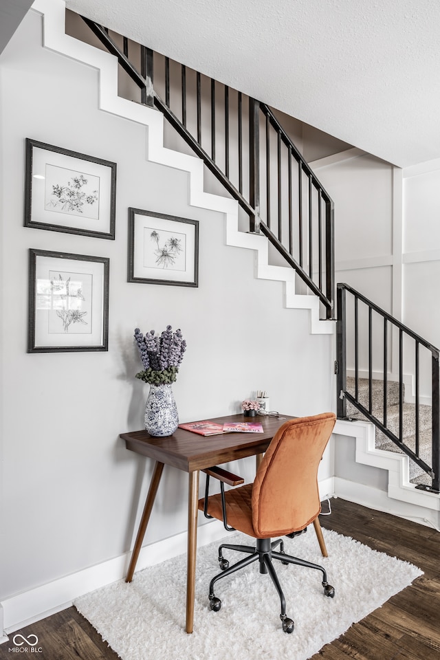 office featuring a textured ceiling and hardwood / wood-style floors