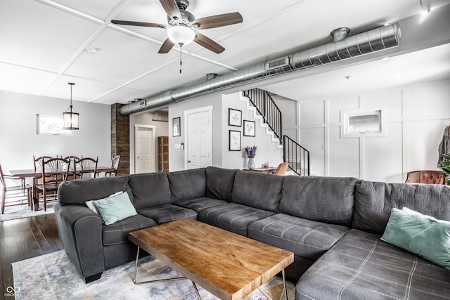 living room with ceiling fan and hardwood / wood-style flooring