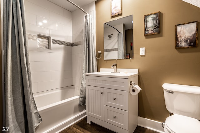 full bathroom featuring hardwood / wood-style floors, vanity, toilet, and shower / bathtub combination with curtain