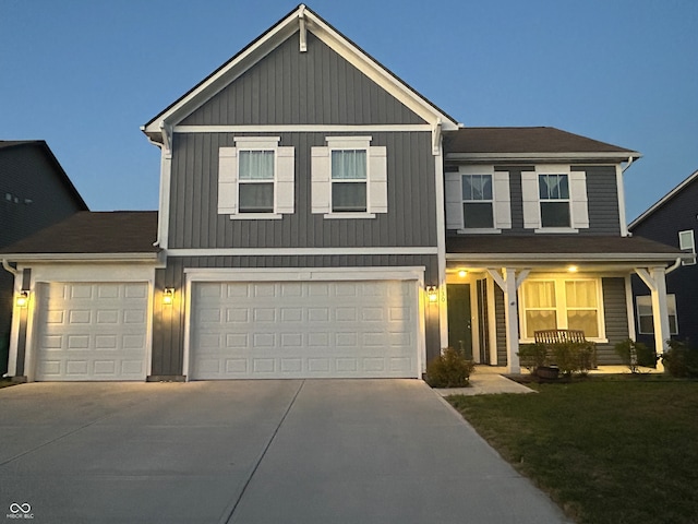 view of front facade featuring a garage and a front yard