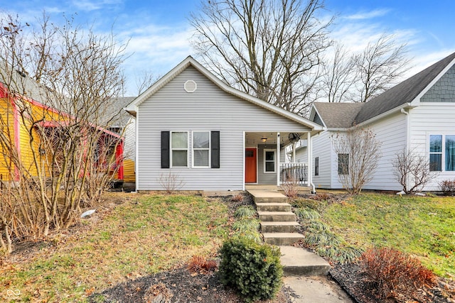 view of front facade featuring covered porch and a front yard