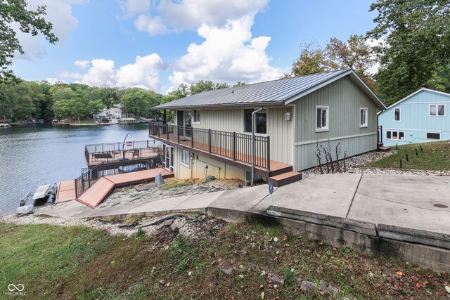 view of dock with a deck with water view