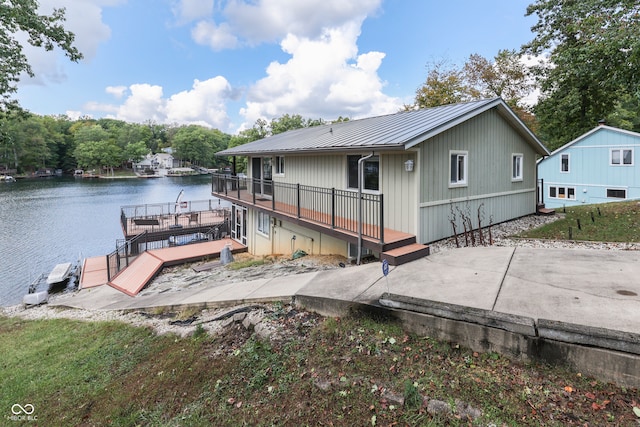 7438 Haw Dr, Nineveh, IN 46164 - exterior space with a dock, a deck with water view, metal roof, and a patio area