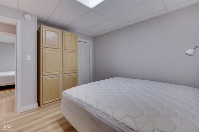 7438 Haw Dr, Nineveh, IN 46164 - bedroom with light wood-style flooring, a closet, and a paneled ceiling