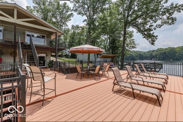 deck featuring a water view