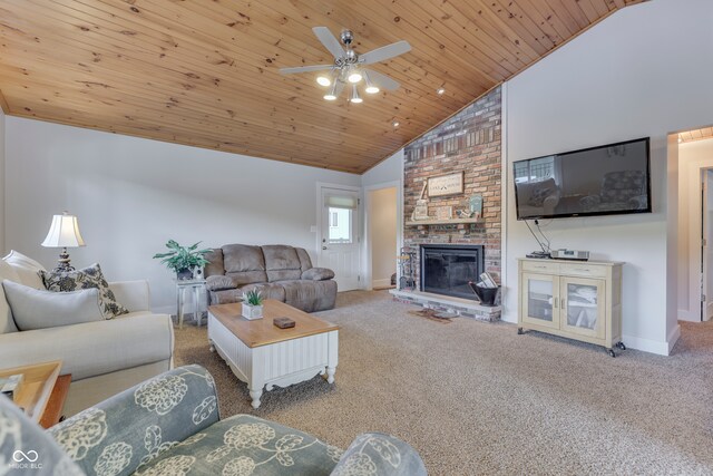 living room with ceiling fan, wood ceiling, a fireplace, and carpet flooring