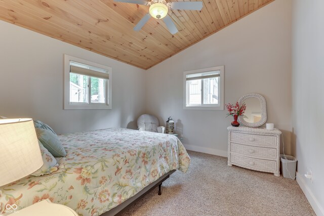 bedroom with wood ceiling, ceiling fan, multiple windows, and light carpet