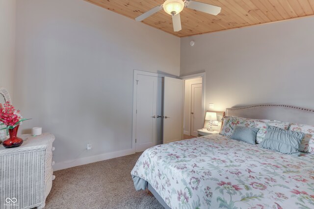 carpeted bedroom featuring wooden ceiling, a towering ceiling, and ceiling fan