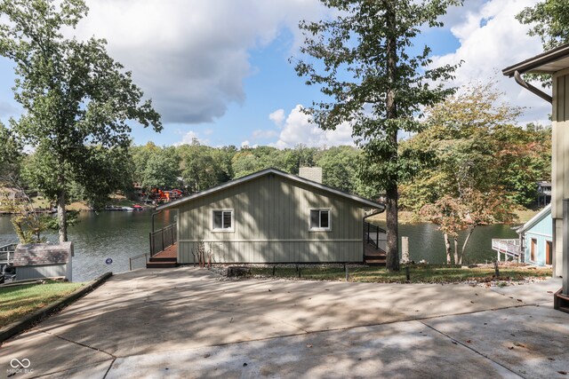 view of property exterior with a water view