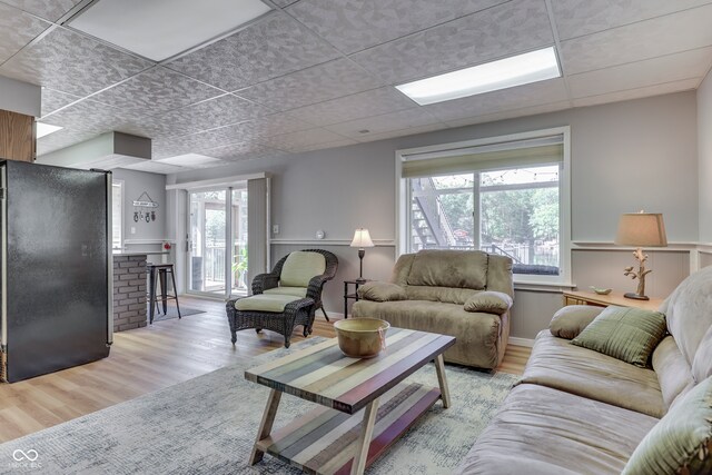 living room featuring light hardwood / wood-style floors and a healthy amount of sunlight