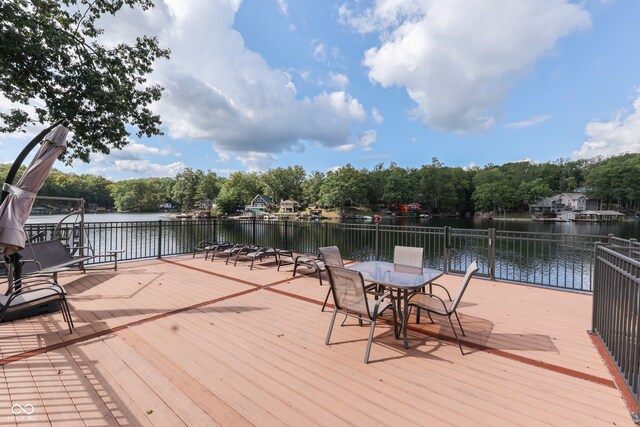 wooden deck featuring a water view