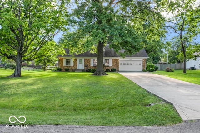 ranch-style home with a front yard and a garage