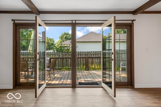 entryway featuring beamed ceiling and hardwood / wood-style floors