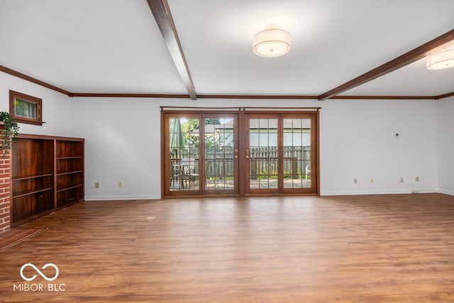 unfurnished living room with light hardwood / wood-style flooring, crown molding, and beam ceiling