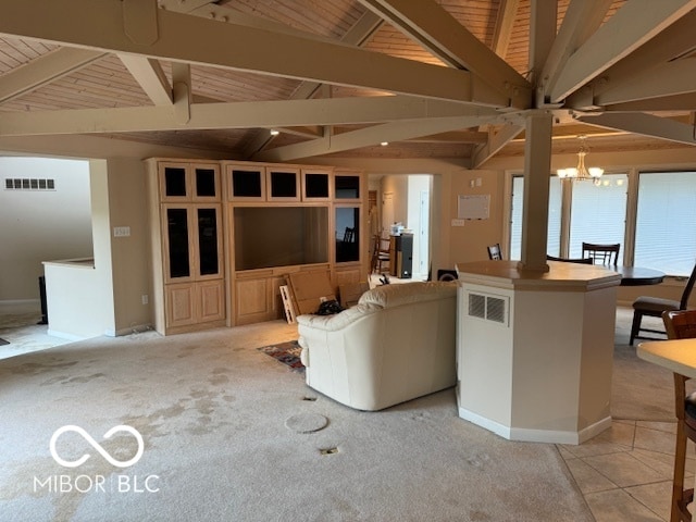 interior space featuring light carpet, wood ceiling, lofted ceiling with beams, and a chandelier