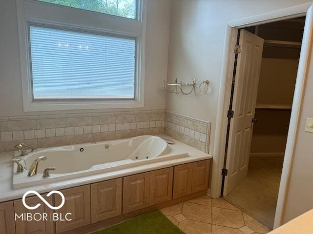 bathroom featuring tile patterned floors and a whirlpool tub