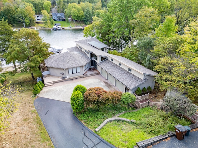 aerial view of property and surrounding area featuring a large body of water
