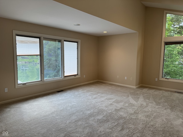empty room with carpet floors and baseboards