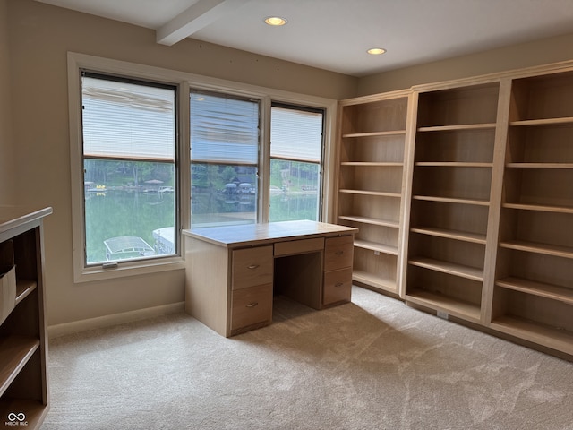 unfurnished office featuring carpet flooring, plenty of natural light, recessed lighting, and baseboards