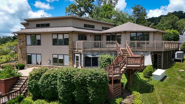 4161 S Summit Ln, Columbus, IN 47201 - rear view of property featuring stairs, a wooden deck, a sunroom, roof with shingles, and stone siding