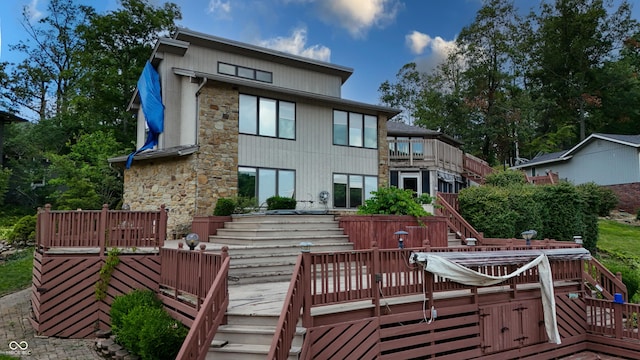 4161 S Summit Ln, Columbus, IN 47201 - back of property featuring stairs, stone siding, and a deck