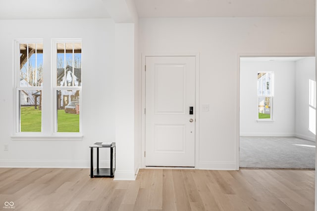 entrance foyer with light wood-type flooring