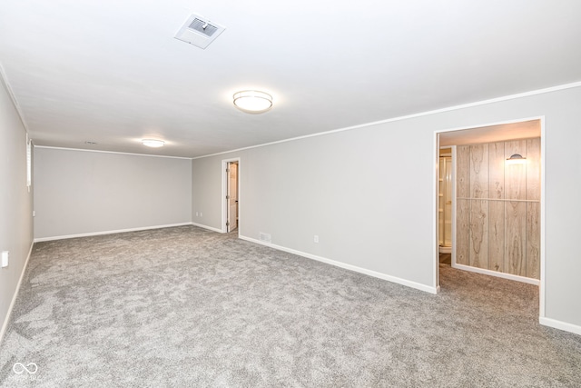 carpeted empty room with ornamental molding