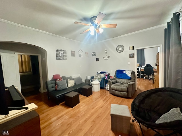 living room with ornamental molding, ceiling fan, and hardwood / wood-style floors