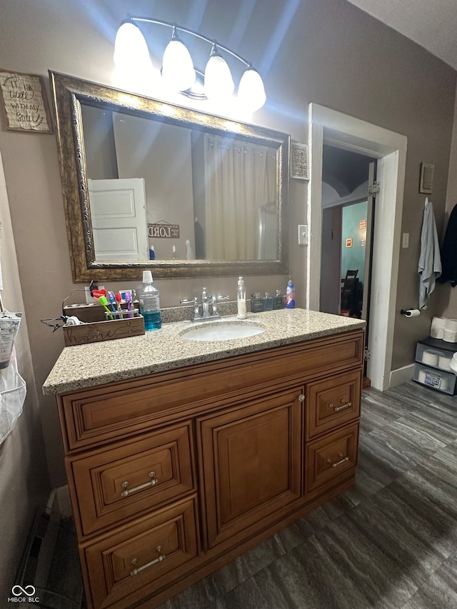 bathroom with vanity and hardwood / wood-style flooring