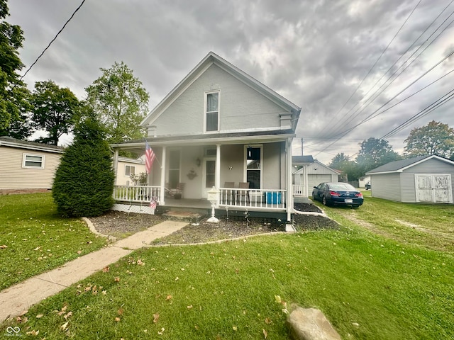 view of front of house with a shed, a porch, and a front yard