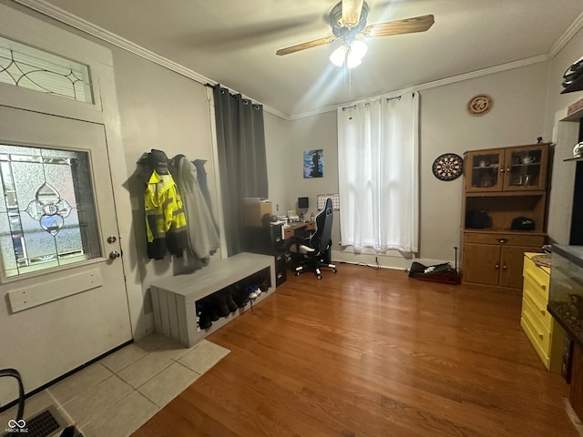 mudroom with wood-type flooring, ornamental molding, and ceiling fan