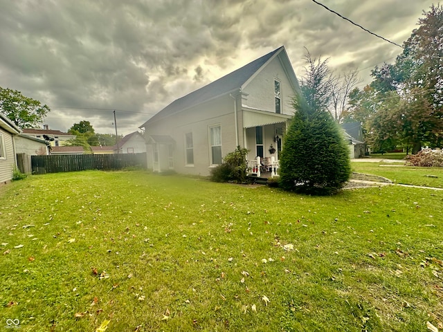 view of property exterior featuring a lawn