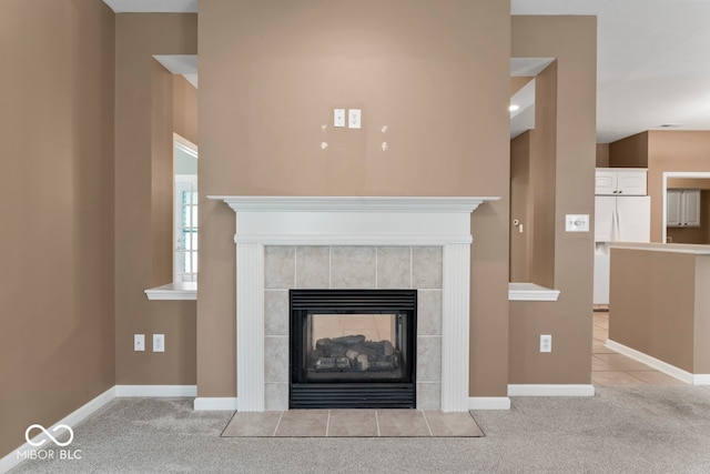 room details with white refrigerator with ice dispenser, carpet floors, a tile fireplace, and white fridge